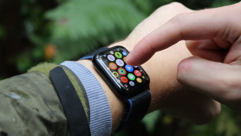 touchscreen watch on wrist with wearer tapping the display